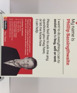 Real estate agent promotional banner with contact details