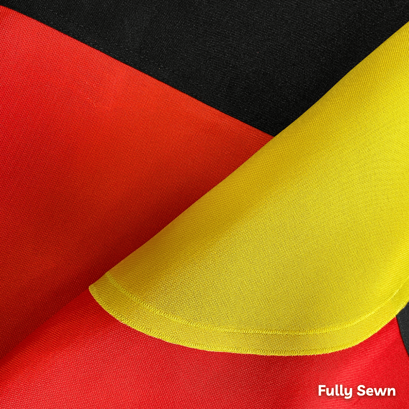 Close-up of red, yellow, and black sewn fabric