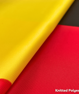 Yellow and red knitted polyester fabric close-up