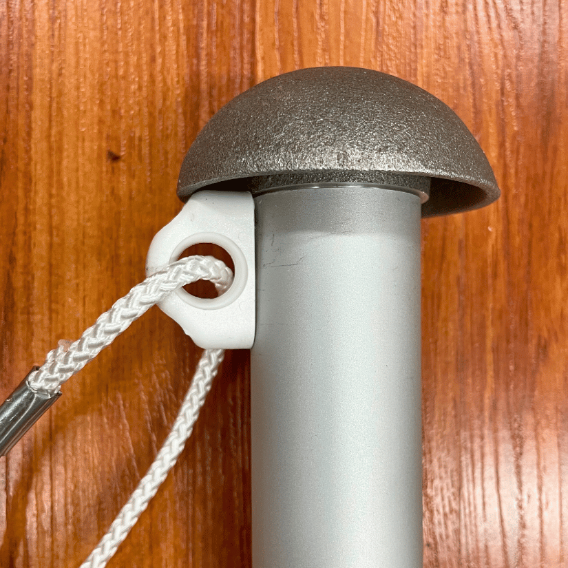Flagpole halyard rope and cleat close-up