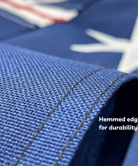 Close-up of hemmed blue fabric edge stitching