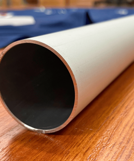 Close-up of a metal pipe on wood surface