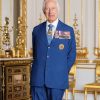Elderly man in blue suit with medals indoors