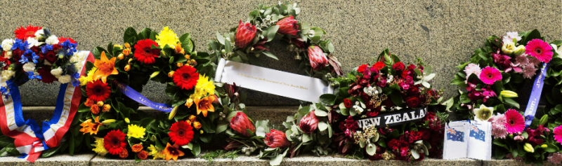 Colorful floral wreaths arranged for remembrance ceremony