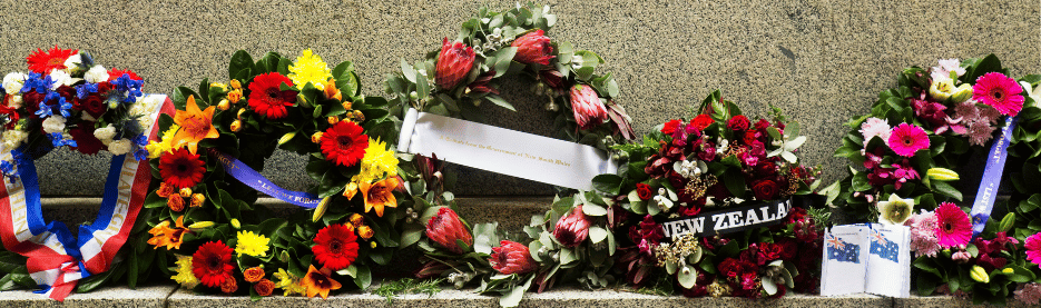 Colorful floral wreaths arranged for remembrance ceremony