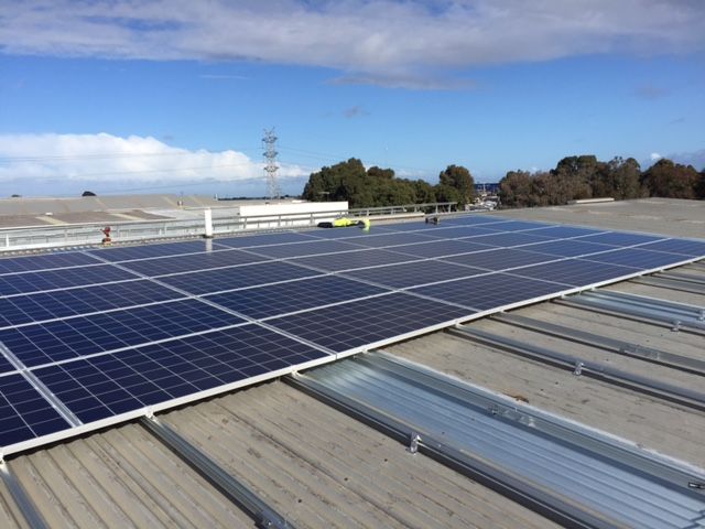 Solar panels installed on a metal rooftop