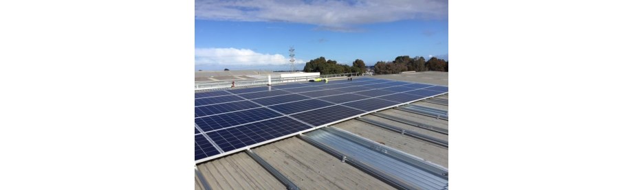 Solar panels installed on industrial rooftop