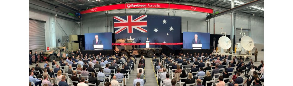 Raytheon Australia event with audience and Australian flag