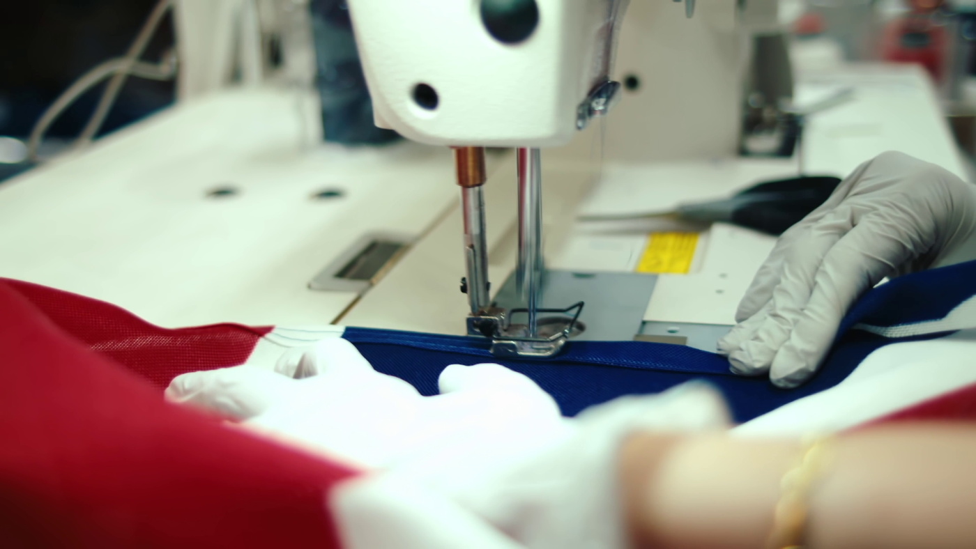 Sewing machine stitching colorful fabric